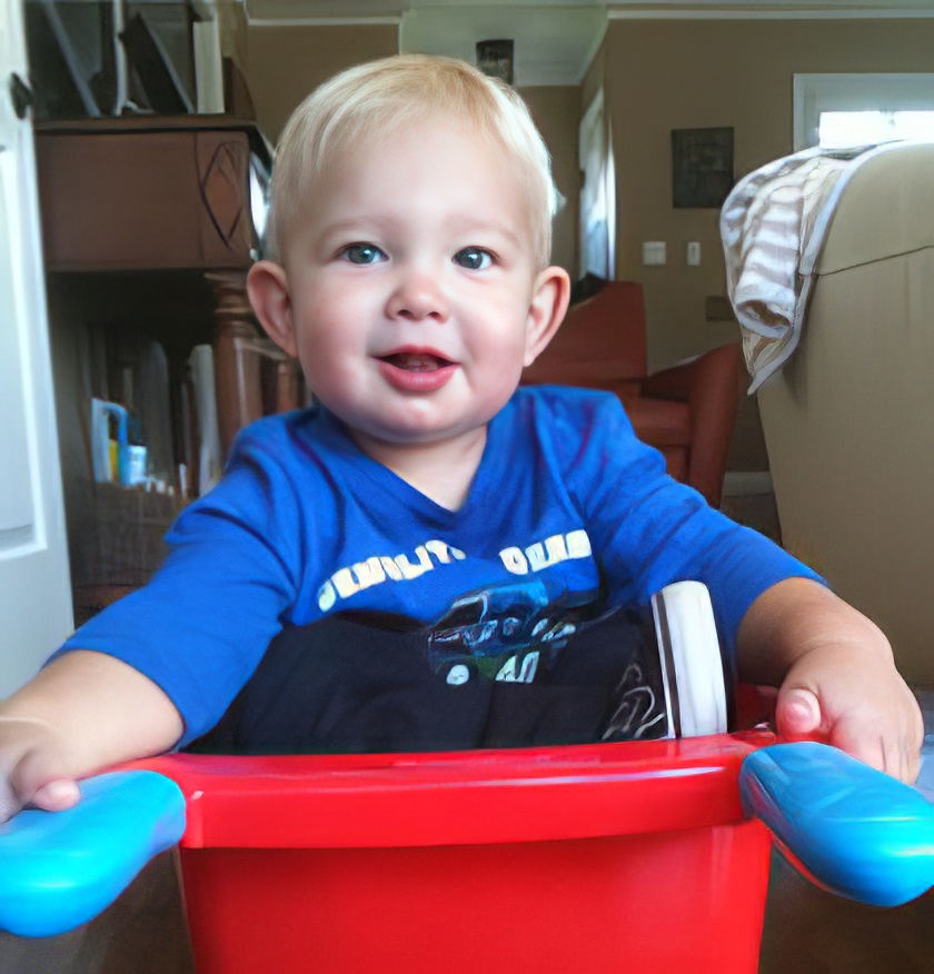 Jasper with a plastic wheelbarrow